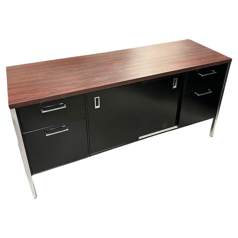 Modern Black & Chrome Metal Tanker Credenza by Steelcase: Vintage Modern black enameled steel tanker Credenza with chromed legs and Walnut Laminate Top. This credenza was made by Steelcase and takes inspiration from the designs of Florence Knoll which can be