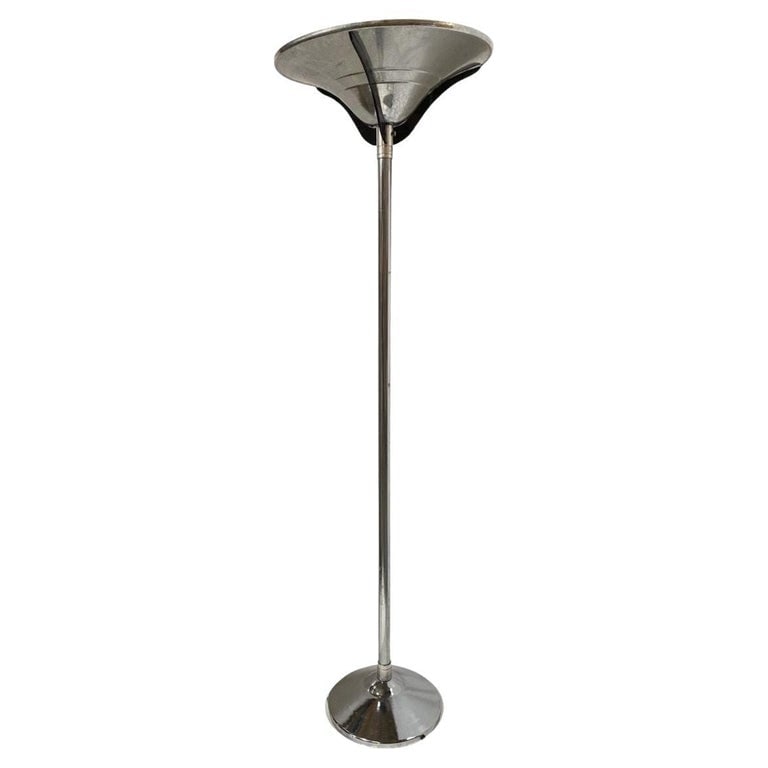 Streamline Chrome Steel Floor Lamp w/ Buttress Braced Saucer Shape: This Mid-Century Modern (MCM) floor lamp embodies the sleek and futuristic design sensibilities of the era. Crafted from polished chrome steel, it exudes a lustrous sheen that adds a touch of sophisti