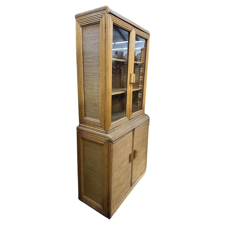 Restored Art Deco Stick Rattan & Grass Mat China Cabinet/Etagere: Immerse yourself in timeless elegance with our meticulously restored Paul Frankl-inspired Art Deco Stick Rattan Bamboo Grass mat Glass China Cabinet/Etagere. The Etagere features a top breakfront with