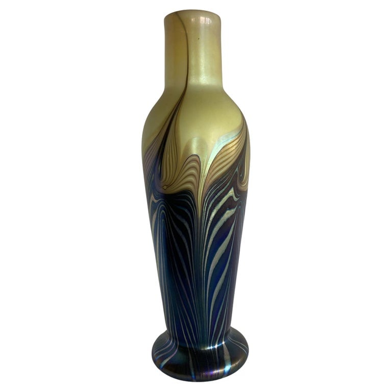 Iridescent 7 Color Art Glass Vase by Lundberg Studio: Iridescent 7 color art glass vase flower vase with a varied ripple pattern. Signed: "Lundberg Studio 1980" Reserve: $483.00 Shipping: Domestic: Shipping rates are determined by destination Internation