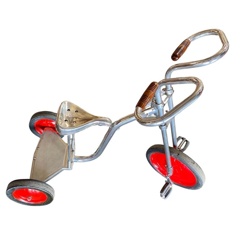 Art Deco Polished Chrome Adult Size Tricycle Trike style of Bowden, 1940: Circa 1940 is polished to chrome steel with walnut-finished handlebars in the style of Bowden Tricycle. This large tricycle with easy fit a small adult 5' 6". Feel to message me with any questions. Re