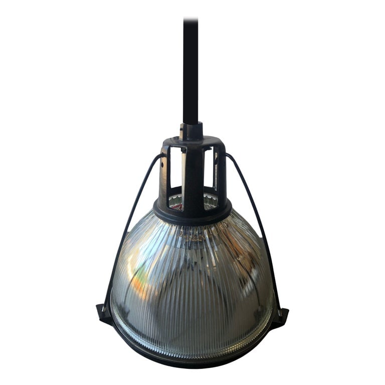 Holophane Industrial Hanging Pendant Lights, 14 available: A Holophane glass ceiling fixture is a type of lighting fixture that features a glass shade with a colorful design that refracts light to create a soft, diffused glow. The Holophane glass shade was fi