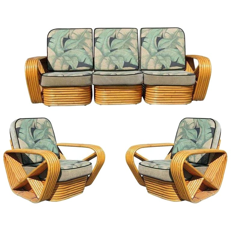 Restored Paul Frankl Style 6 strand Rattan Sofa & Lounge Chair Set: Paul Frankl-style rattan living room set includes a matching three-seat sectional sofa and a pair of lounge chairs. Both feature the famous six-strand square pretzel side arms and stacked rattan base 
