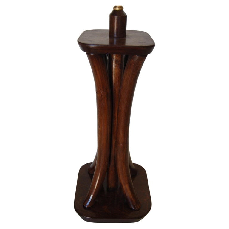 Restored 4-Strand Rattan Bent Pole Table Lamp on Mahogany Base: Restored Four Strand dark stained rattan bent pole table lamp with mahogany bases. Measures 8.5 " Wide x 8.5" Deep x x 24" Tall. 1950, United States We only purchase and sell only the best and finest 