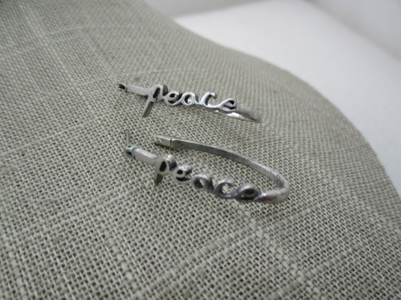 Vintage Silver Peace Hoop Earrings, Pierced: Title: Vintage Silver Peace Hoop Earrings, Pierced Description: Vintage Peace Hoop Earrings, Pierced, Silver Tone, 1.25" long and appx. 5/8" opening from front-to-back. Peach is written on the front h