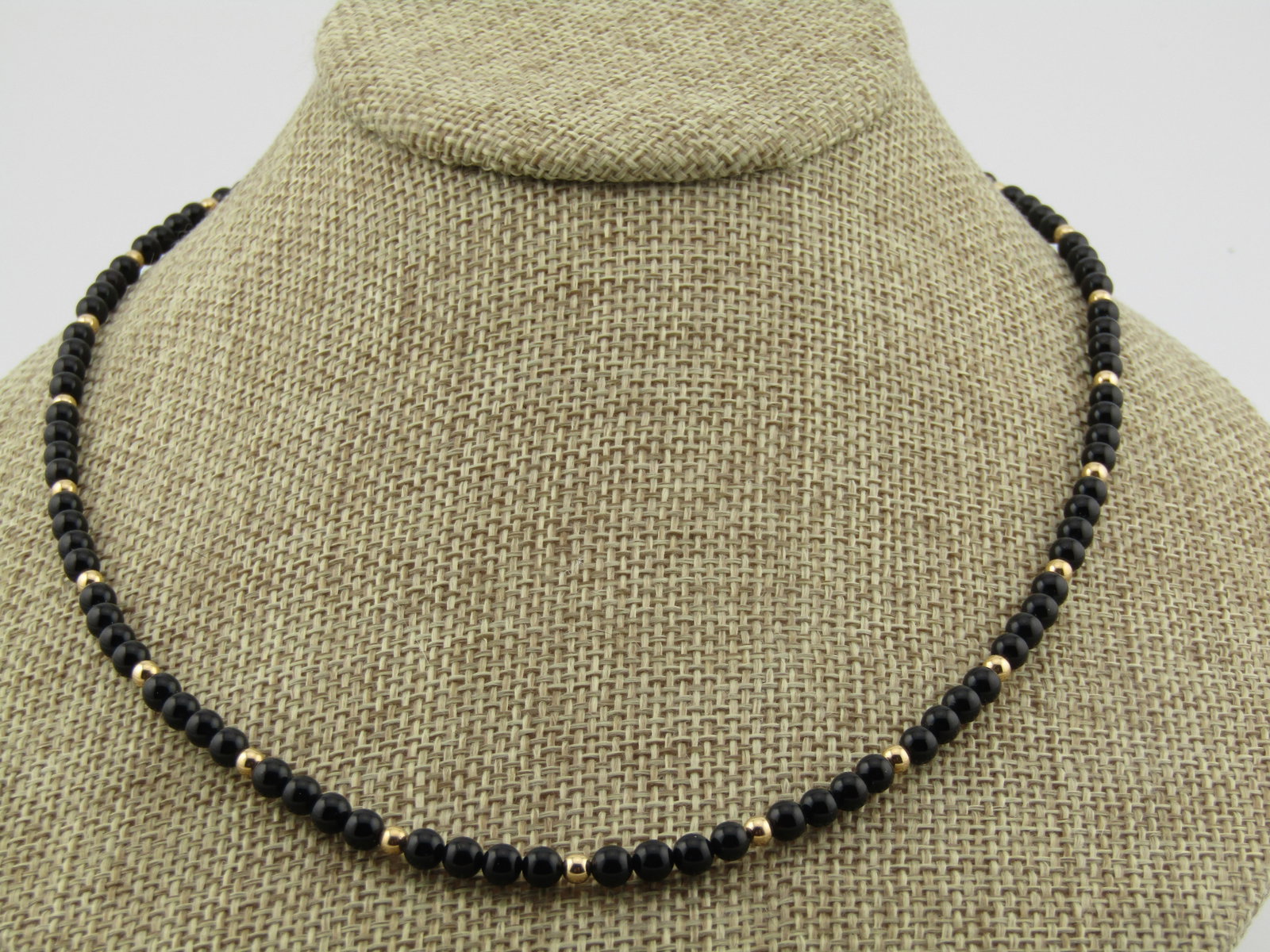 Vintage 14kt Onyx & Gold Beaded Necklace, 18.5" , 4mm, 1970's-1980's: Title: Vintage 14kt Onyx & Gold Beaded Necklace, 18.5" , 4mm, 1970's-1980's Description: Vintage 14kt Onyx & Gold Beaded Necklace, 18.5" , 4mm, 1970's-1980's. This hs onyx beads that ar appx. 4mm roun