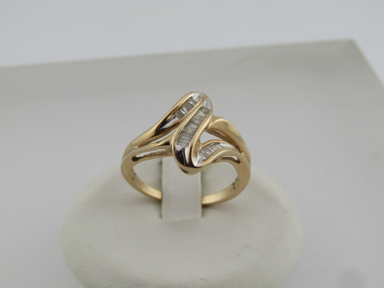 Vintage 10kt Diamond Channgel Set Ring, ZigZag, Sz. 7.5, Signed, 1990's: Title: Vintage 10kt Diamond Channgel Set Ring, ZigZag, Sz. 7.5, Signed, 1990's Description: Vintage 10kt Diamond Channgel Set Ring, ZigZag, Sz. 7.5, Signed, 1990's. This has an angeled design with a c