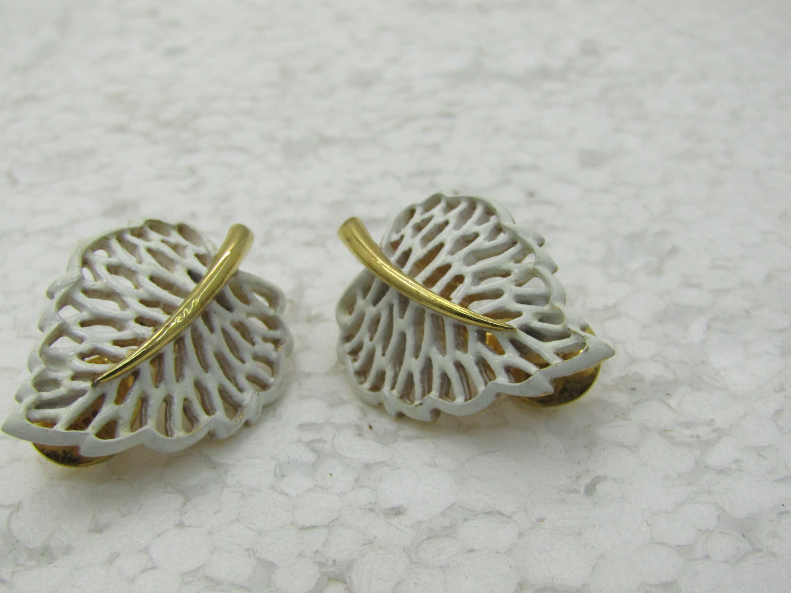 Vintage Monet Enameled Leaf Earrings, White & Gold Tone, 1960's-1970s: Title: Vintage Monet Enameled Leaf Earrings, White & Gold Tone, 1960's-1970s Description: Vintage Monet Enameled Leaf Earrings, White & Gold Tone, 1960's-1970s.White filigree leave with gold tone