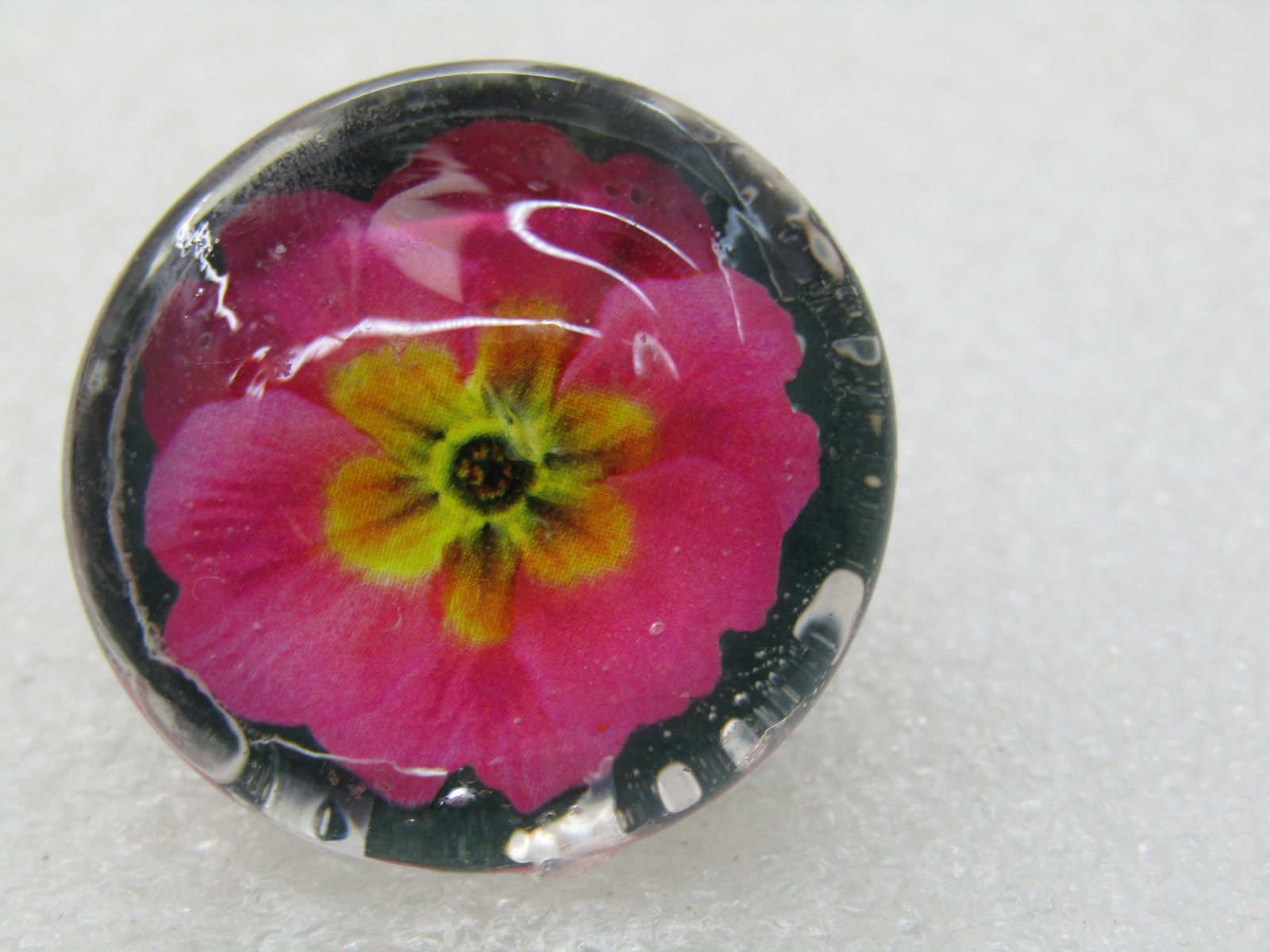 Vintage Glass Floral Reverse Painted Brooch, Pink Blossom, 1": Title: Vintage Glass Floral Reverse Painted Brooch, Pink Blossom, 1" Description: Vintage Glass Floral Reverse Painted Brooch, Pink Blossom, 1" round with a pink blossom with yellow shaded center. Not