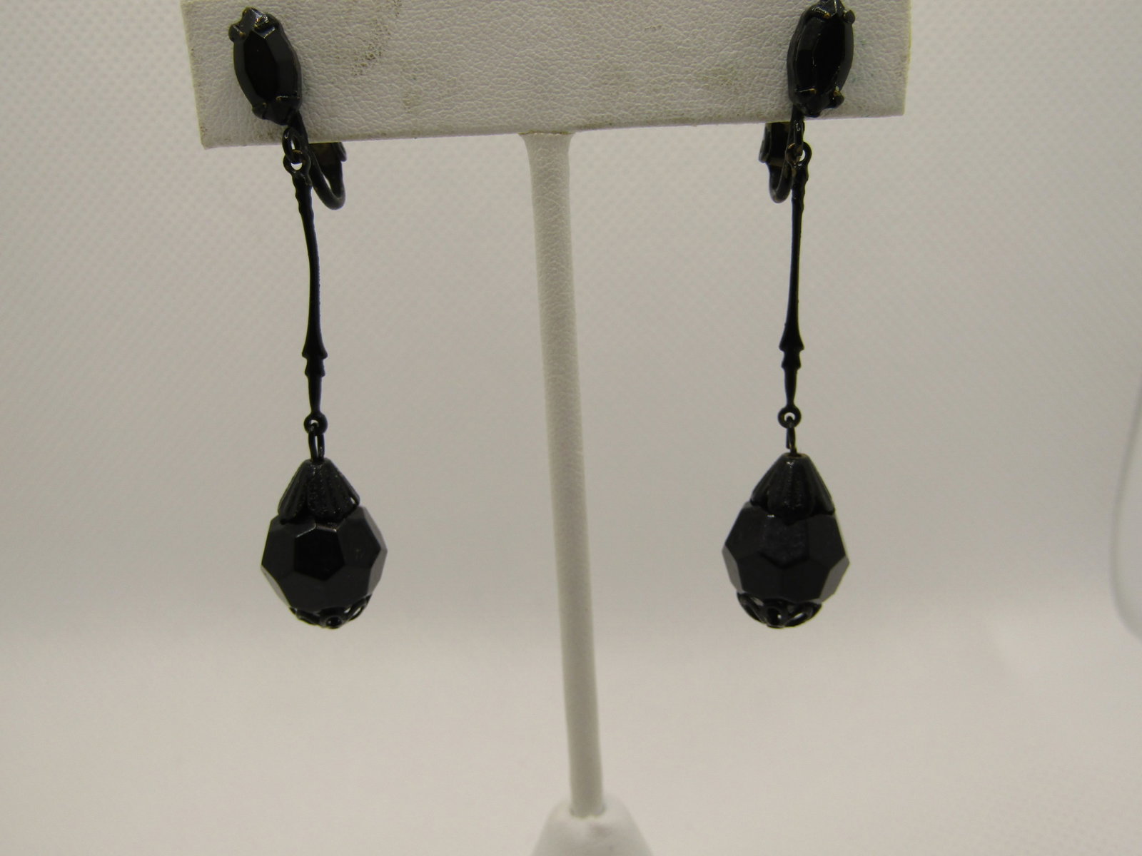 Vintage Black Rhinestone Drop Earrings, Clip, 2.25": Title: Vintage Black Rhinestone Drop Earrings, Clip, 2.25" Description: Vintage Black Rhinestone Drop Earrings, Clip, 2.25". Appx. 1970's-1980's. A marquise 9.5 by 5mm black glass stone at the lobe wi