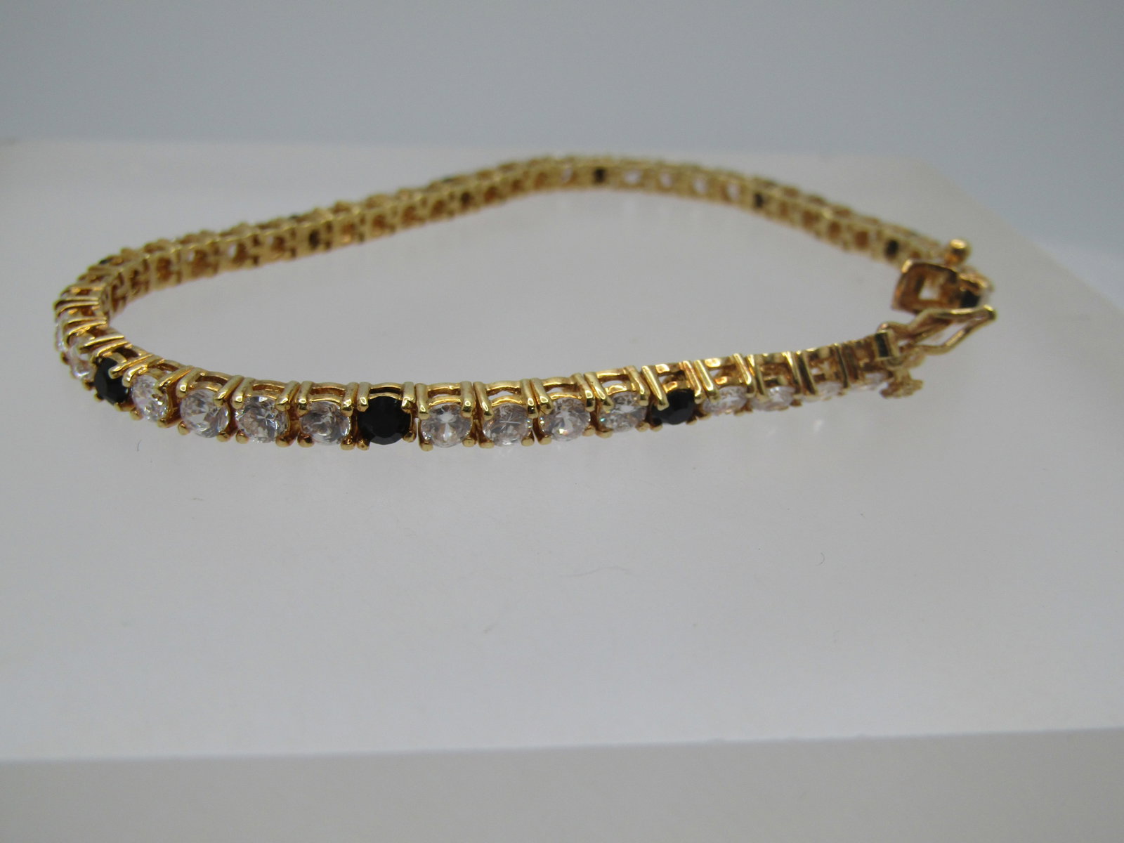 Vintage Black & Clear Tennis Bracelet, 7.25", Signed LR, 1980's-1990's: Title: Vintage Black & Clear Tennis Bracelet, 7.25", Signed LR, 1980's-1990's Description: Vintage Black & Clear Tennis Bracelet, 7.25", Signed LR, 1980's-1990's. This has four clear stones and then a