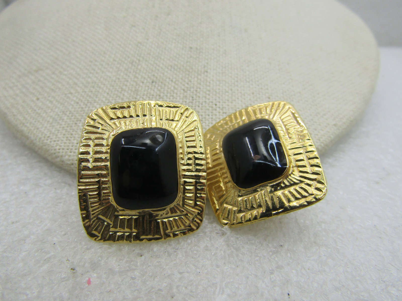 Vintage Goldtone Black Rectangular Clip Earrings, 1980's.: Title: Vintage Goldtone Black Rectangular Clip Earrings, 1980's. Description: Vintage Goldtone Black Rectangular Clip Earrings, 1980's. 1-1/8" long and 1" wide with a stamed frame around a bezel-st bl
