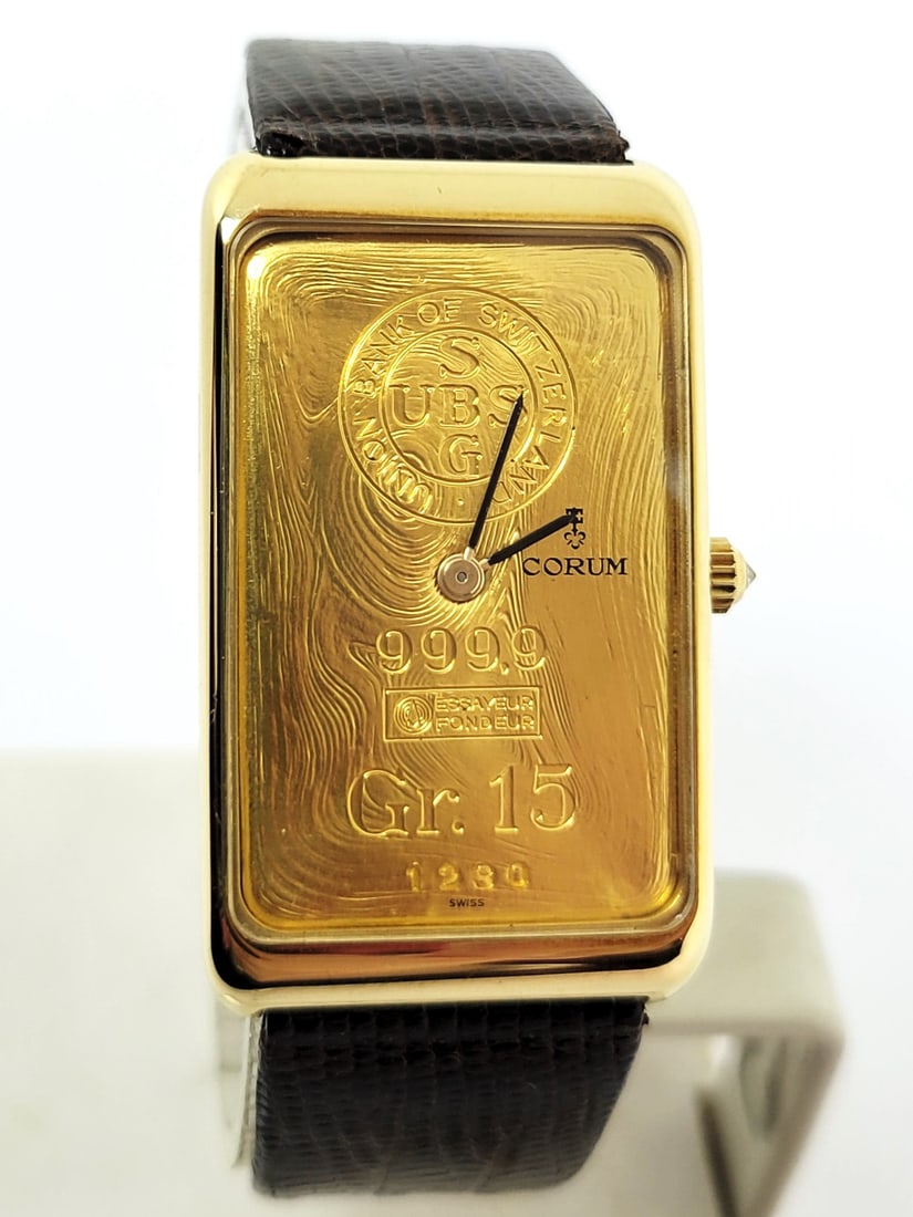 18k CORUM Mens Winding Watch 55400 with 24K INGOT BAR 15 GR Diamond Crown* EXLNT: Vintage 18k CORUM Men's Winding Watch 55400 with 24K INGOT BAR 15 GR Diamond Crown* EXLNT This Men's Corum watch is Swiss made. Great present for yourself or someone you love! * Solid 18k Yellow gold 
