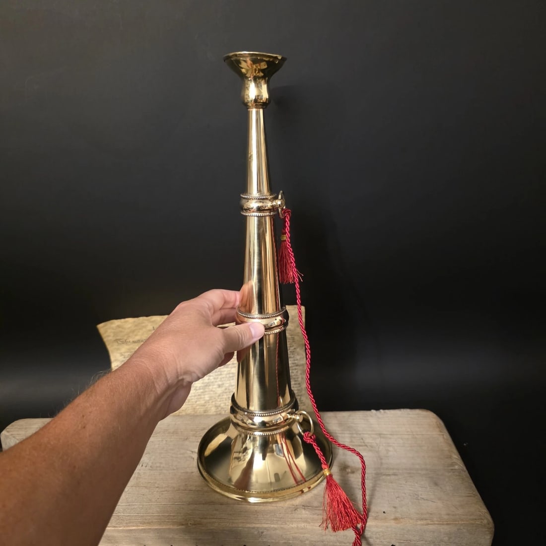 16 1/2" Polished Brass Gold Fireman Presentation Speaking Trumpet: 16 1/2" Tall x 6 1/4" Wide Brass fireman's speaking trumpet with red cord. Speaking trumpets were used by fire officers during the 19th and early 20th centuries to project commands at fire scenes