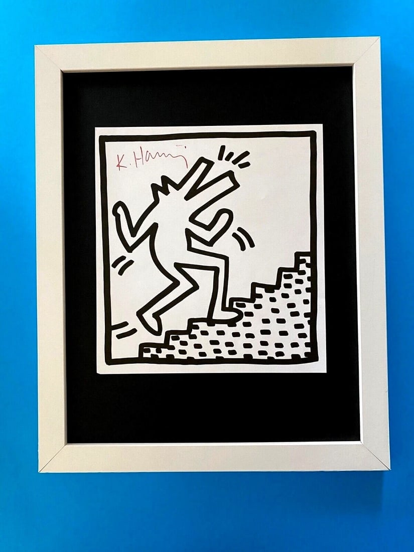 Keith Haring | Iconic Print Signed Collector Piece Framed ONLY 1 LEFT: Up for Auction this Beautiful and Scarce Vintage 1989 Offset Lithograph after Keith Haring Facsimile Signed in ink. Art Print is about 8 X 8 in. This piece is mounted on a 11 x 14 in. black acid free
