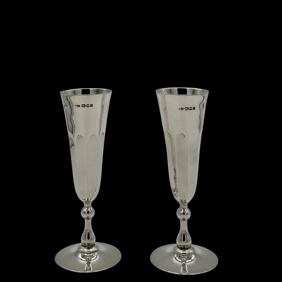 Mid 20th Century Modern Sterling Silver Pair Champagne Flutes London 1961 LAG: Title:Mid 20th Century Modern Sterling Silver Pair Champagne Flutes London 1961 LAG Description:Description Stylish pair of silver champagne flutes decorated with elegant half flute bowls and