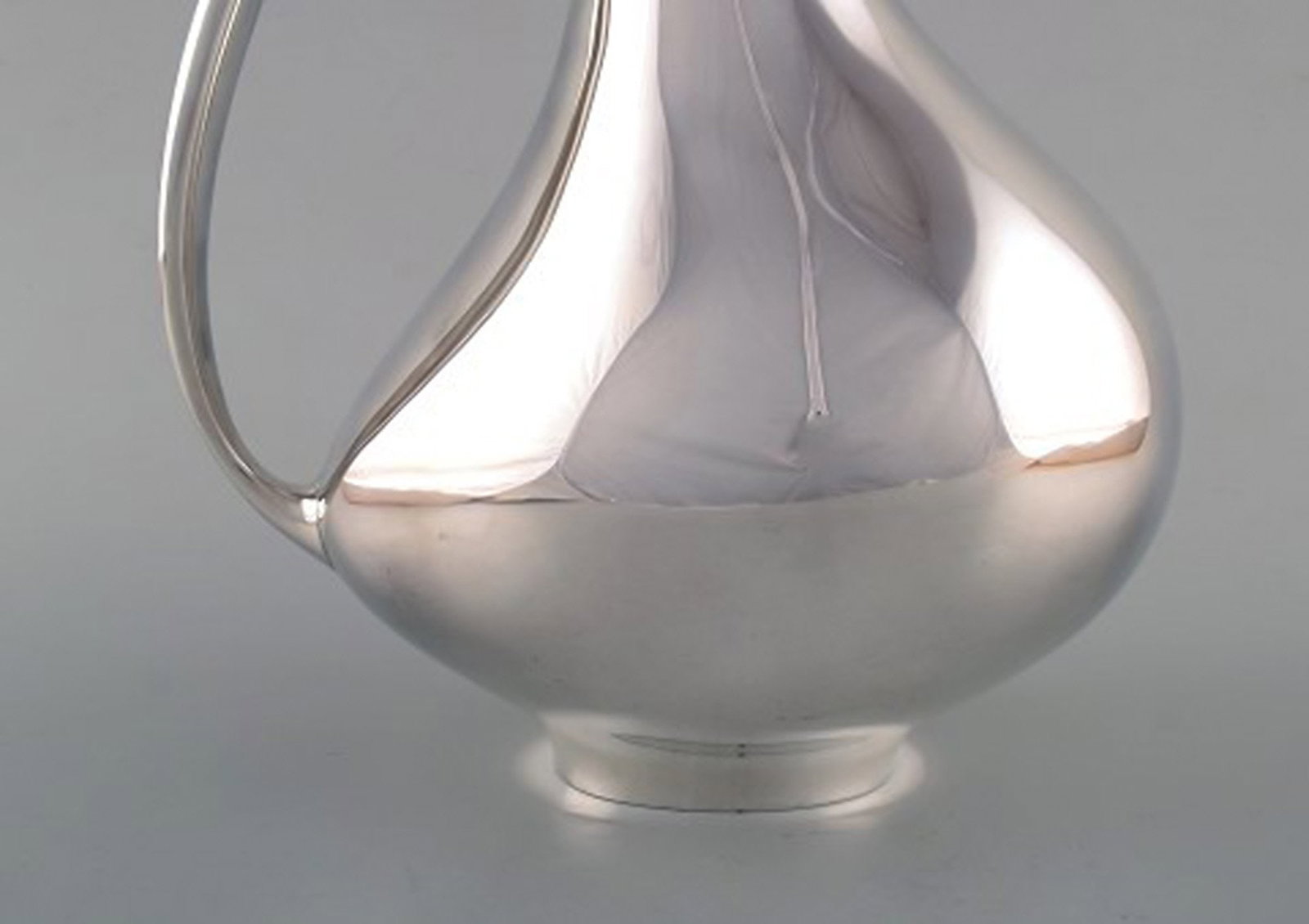 Henning Koppel for Georg Jensen. Modernist sterling silver jug. 'The Pregnant Duck'. Model number - 4