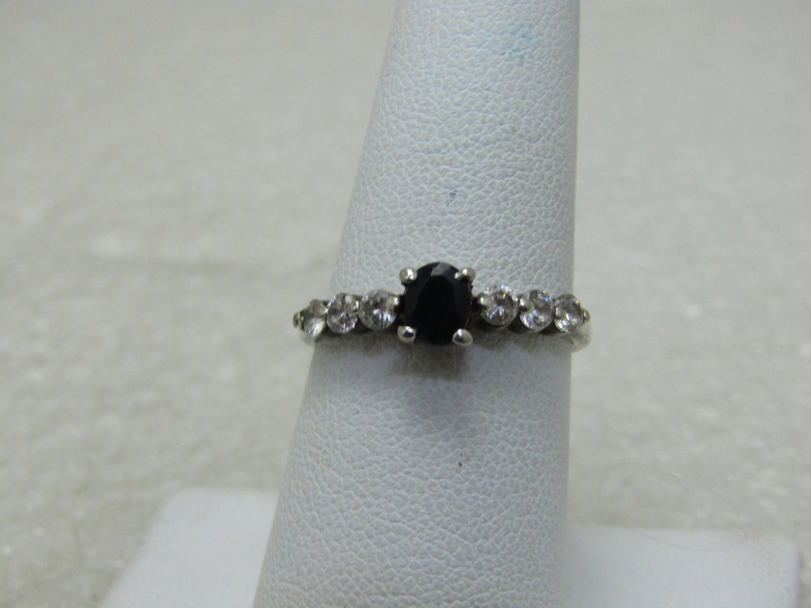 Black Spinel & CZ Ring, SZ 7.25, Marked .925: Title: Black Spinel & CZ Ring, SZ 7.25, Marked .925 Description: Black Spinel & CZ Ring, SZ 7.25, Marked .925 0 oval black spinel that is appx. 5mm by 3.5mm set in center with graduated clear CZs