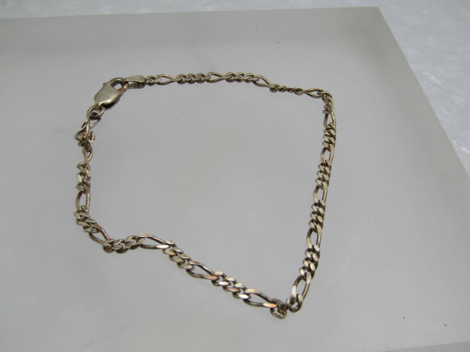Vintage Sterling Figaro Link Bracelet, 8", Unisex , Signed Coara, 2.8mm: Title: Vintage Sterling Figaro Link Bracelet, 8", Unisex , Signed Coara, 2.8mm Description: Vintage Sterling Figaro Link Bracelet, 8", Unisex , Signed Coara, 2.8mm. Lobster clasp and marked Italy,