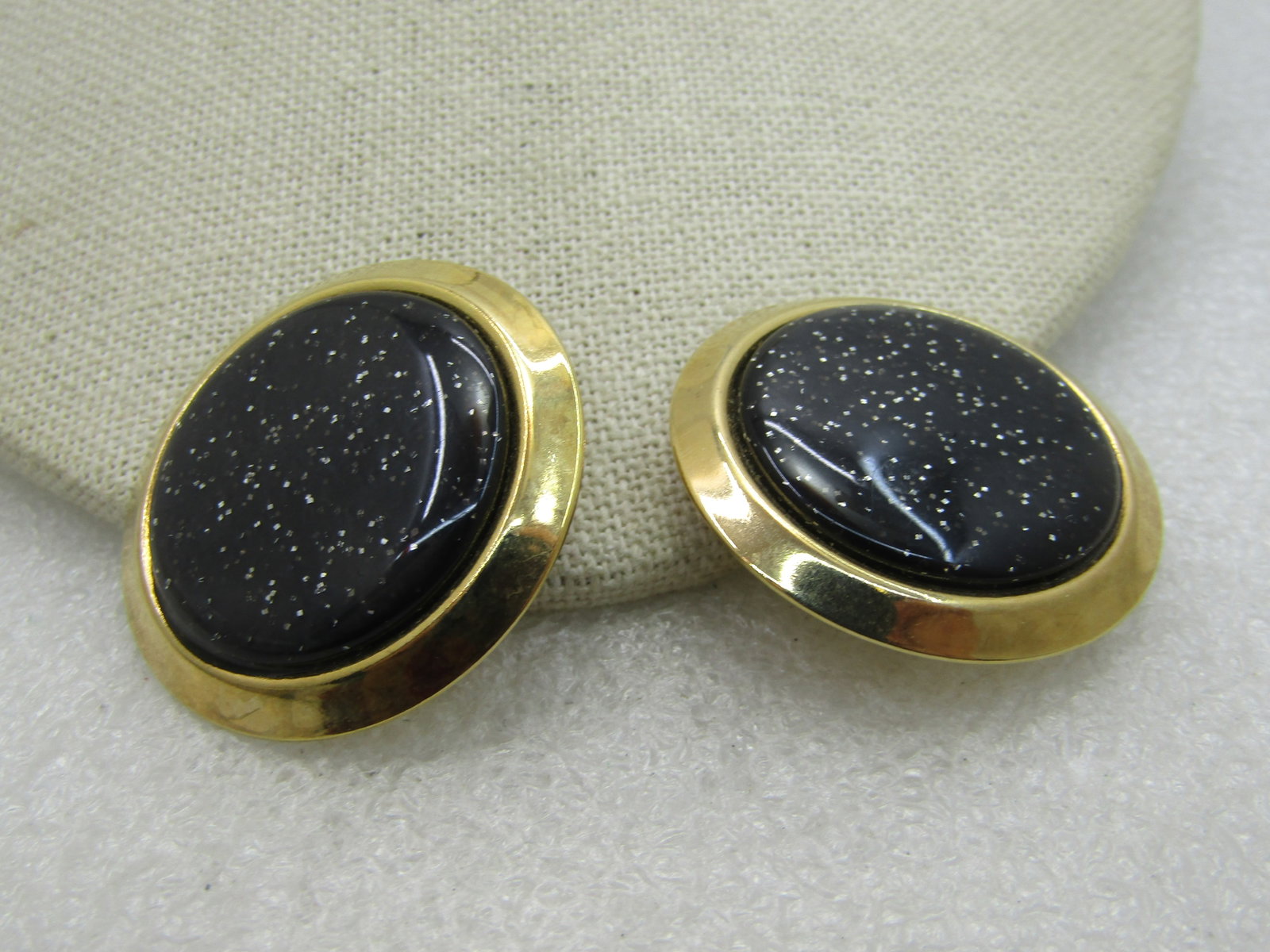 Vintage Black Glitter Clip Earrings, 1.5", 1980's: Title: Vintage Black Glitter Clip Earrings, 1.5", 1980's Description: Vintage Black Glitter Clip Earrings, 1.5", 1980's Gold tone frame around the black silver glittered insert. Not signed by maker. V