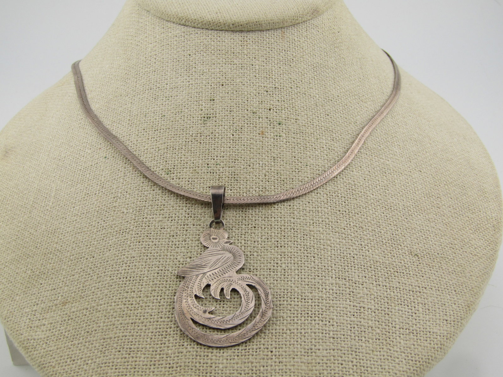 Vintage Sterling Mexican Quetzal Bird Pendant on 20" Herringbone Chain, 1970's-1980's: Title: Vintage Sterling Mexican Quetzal Bird Pendant on 20" Herringbone Chain, 1970's-1980's Description: Vintage Sterling Mexican Quetzal Bird Pendant on 20" Herringbone Chain, 1970's-1980's. It is a
