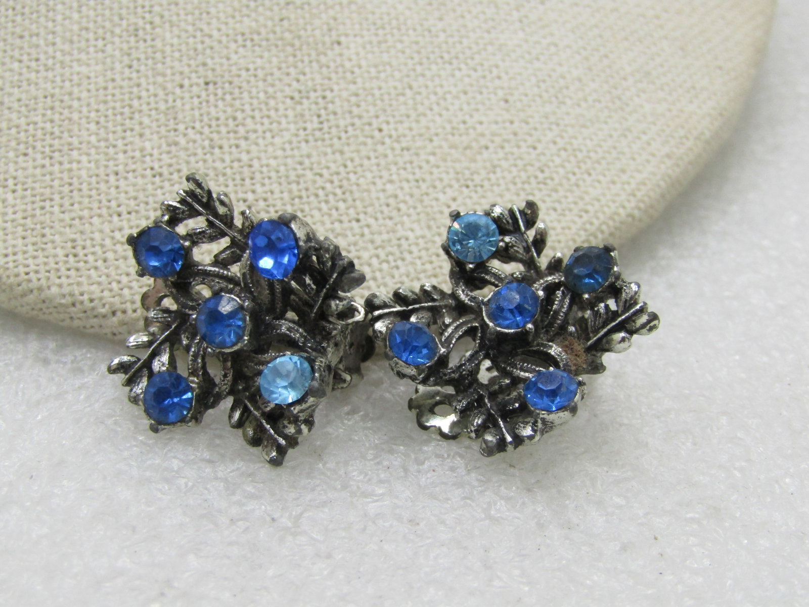 Vintage Blue Rhinestone Clip Earrings. 3/4", Silver Tone, 1960's-1970's: Title: Vintage Blue Rhinestone Clip Earrings. 3/4", Silver Tone, 1960's-1970's Description: Vintage Blue Rhinestone Clip Earrings. 3/4", Silver Tone, 1960's-1970's, Shades of blue, aquamarine and sapp