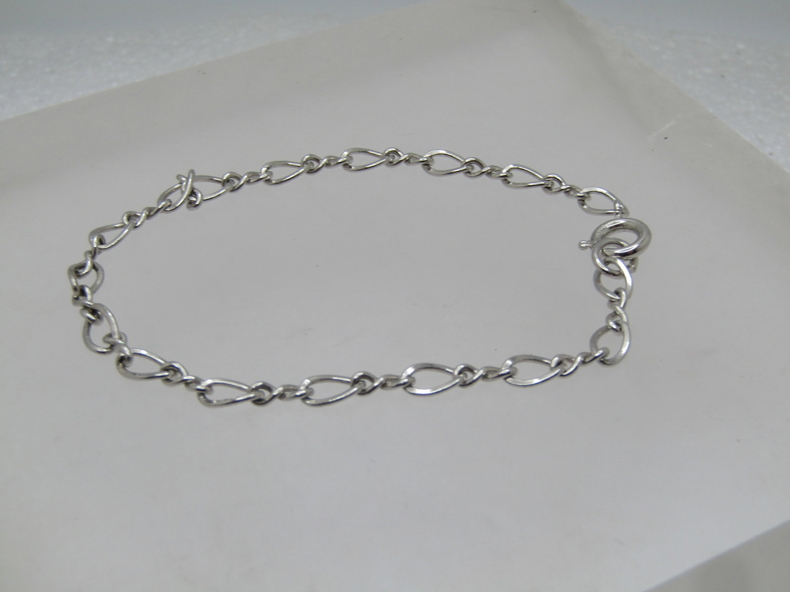 Vintage Sterling Bracelet, 7", 1980's-1990's, Signed: Title: Vintage Sterling Bracelet, 7", 1980's-1990's, Signed Description: Vintage Sterling Bracelet, 7", 1980's-1990's, Signed with what looks like a W inside a circle. Spring clasp. It is appx. 3.5mm