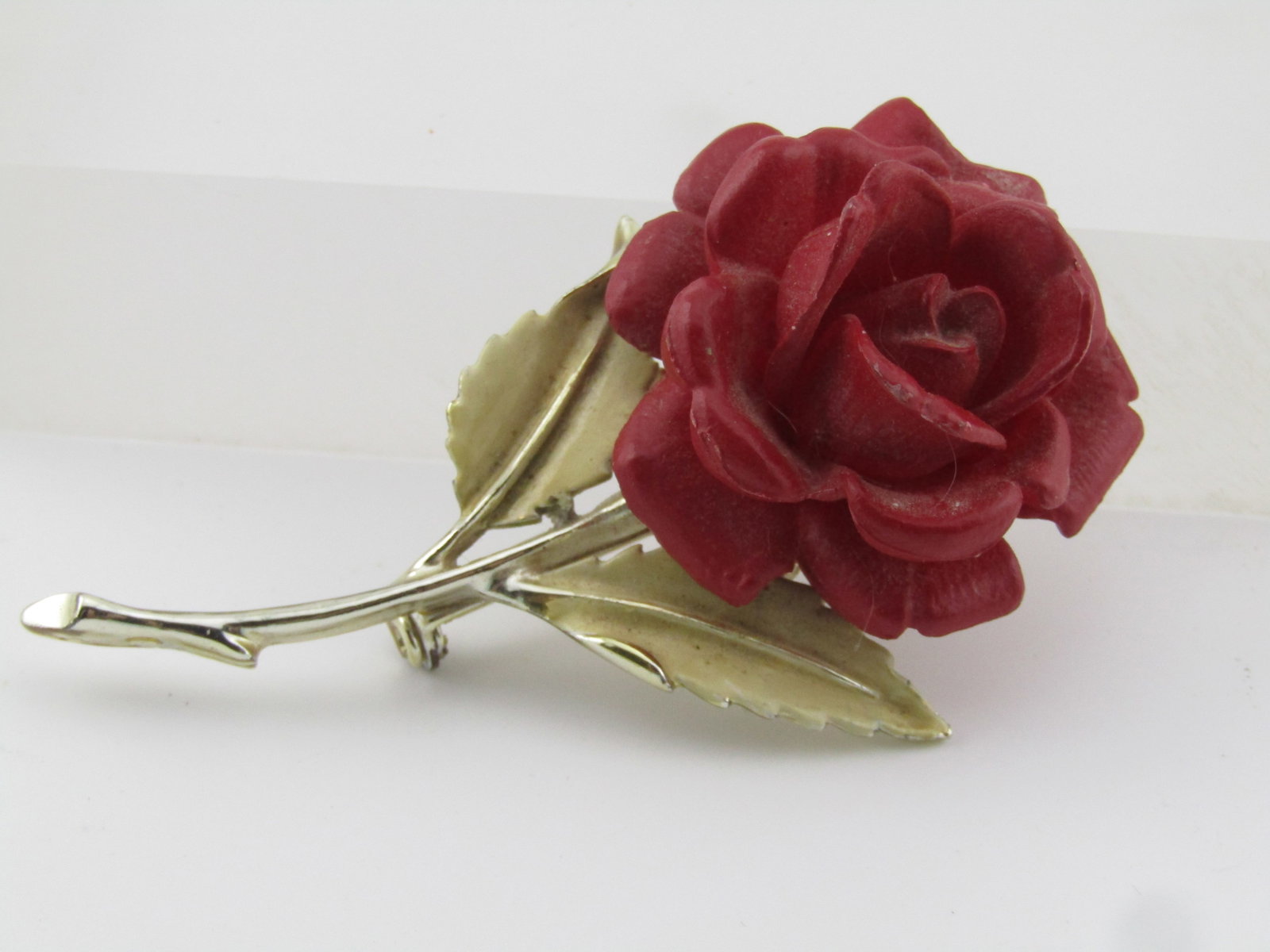 Vintage Red Rose & Enameled Floral Stem Brooch, 1950's-1960's: Title: Vintage Red Rose & Enameled Floral Stem Brooch, 1950's-1960's Description: Vintage Red Rose & Enameled Floral Stem Brooch, 1950's-1960's. This has a raised molded red acrylic rose set on a gold