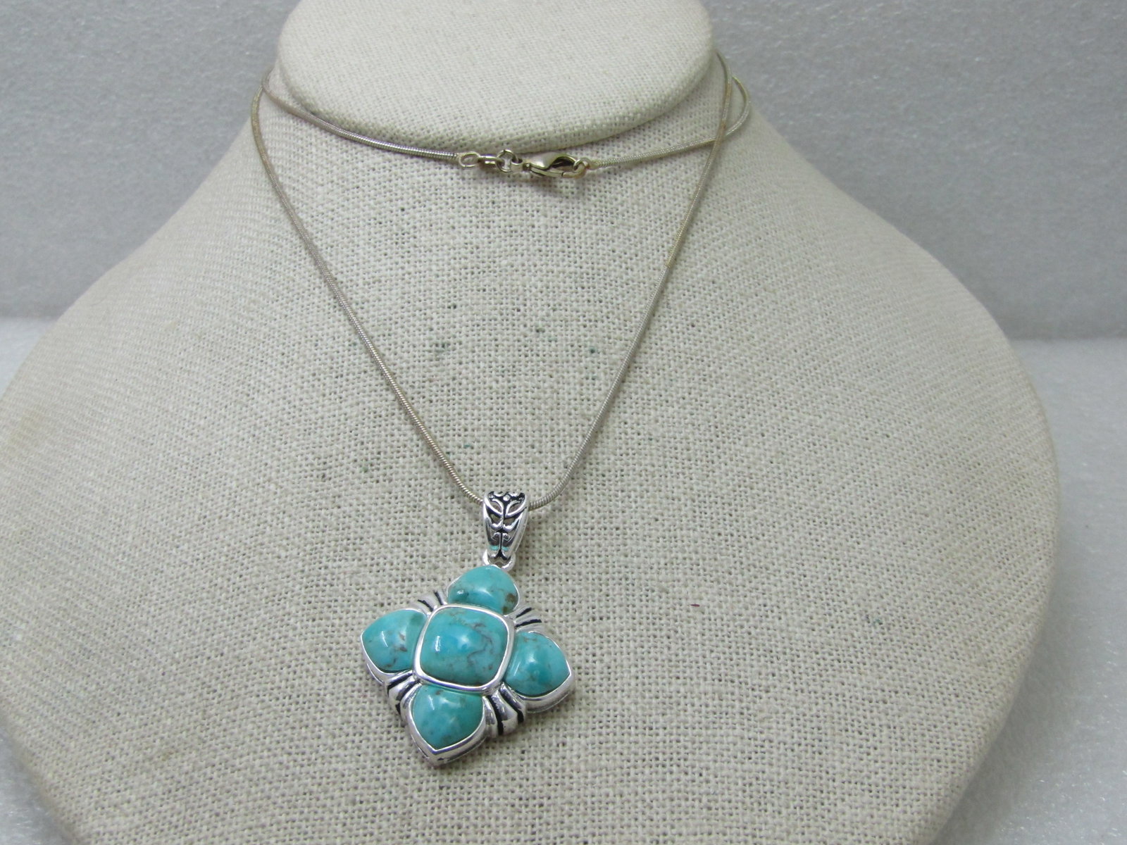 Southwestern Faux Turquoise Necklace, Silver Tone, 24" Snake Chain: Title: Southwestern Faux Turquoise Necklace, Silver Tone, 24" Snake Chain Description: Southwestern Faux Turquoise Necklace, Silver Tone, 24" Snake Chain. Pendant with stamped swing bail and a pendant