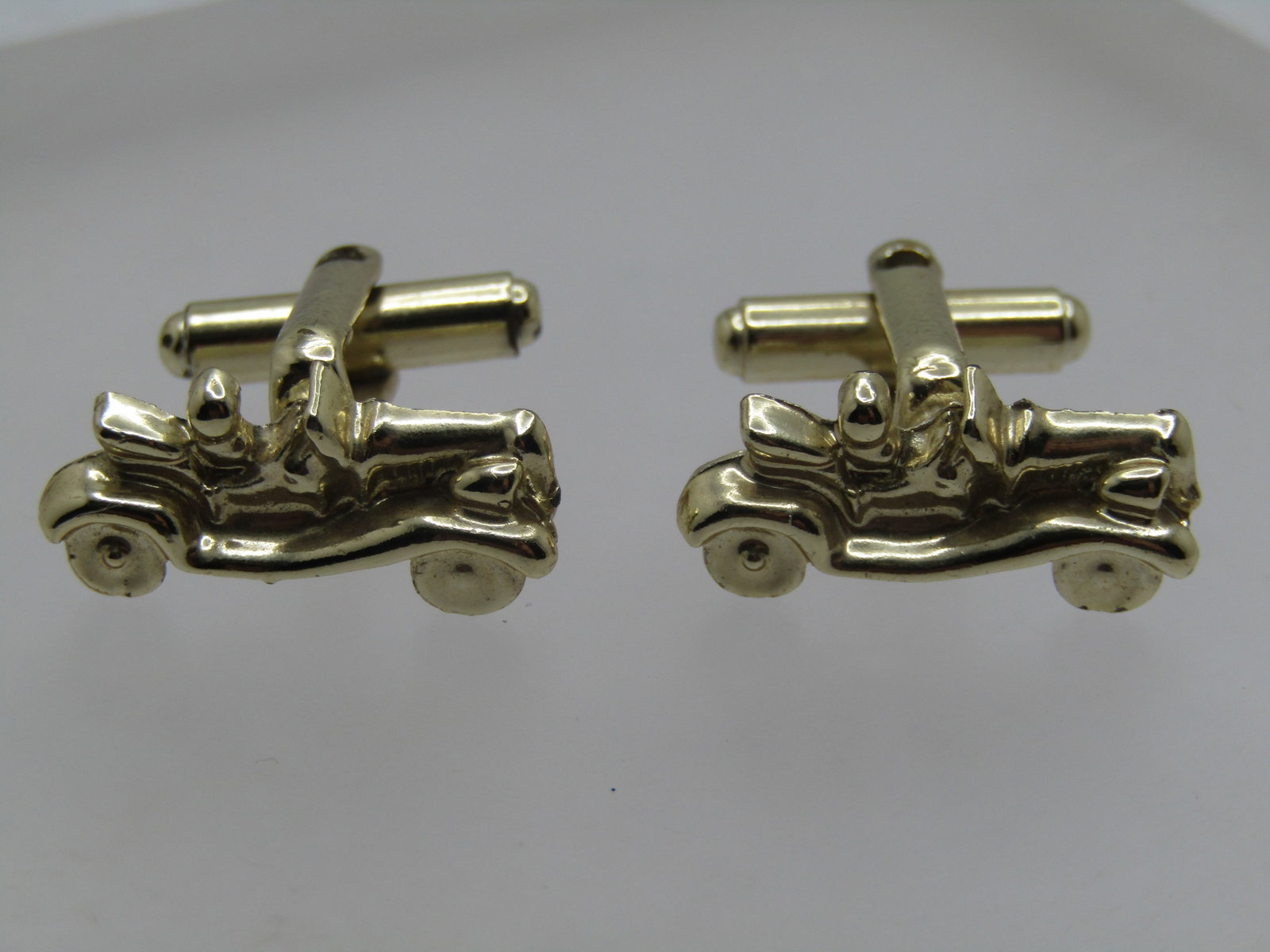 Vintage Roadster Cufflinks, 1950's-1960's: Title: Vintage Roadster Cufflinks, 1950's-1960's Description: Vintage Convertible Roadster Cufflinks, 1950's-1960's. Gold tone cufflinks that are ap+px. 7/8" wide and 1/3" tall with a convertible