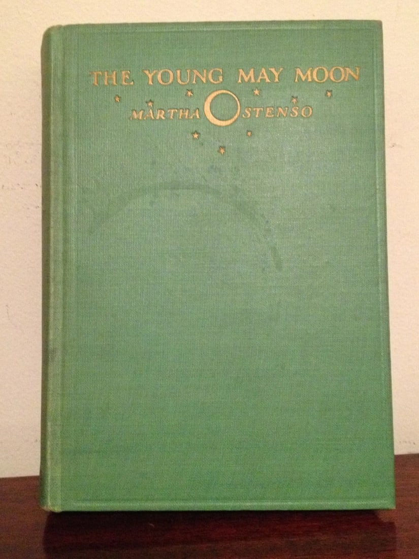 THE YOUNG MAY MOON BY Martha Ostenso 1929 1st/1st Dodd,Mead HC: THE YOUNG MAY MOON BY Martha Ostenso. New York, Dodd, Mead & Company 1929. 1st Edition, 1st Printing. Hardcover, green cloth boards, gilt title & decoration to front cover and spine, decorated endpape