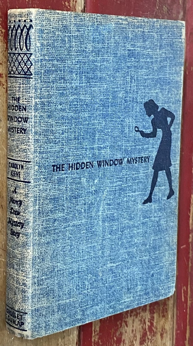 Nancy Drew The Hidden Window Mystery #34 1956 Carolyn Keene VINTAGE HC VGood: The product is a vintage hardcover book titled "Nancy Drew The Hidden Window Mystery" written by Carolyn Keene. It was published in 1956 by Grosset & Dunlap in New York as part of the Nancy Drew Myste