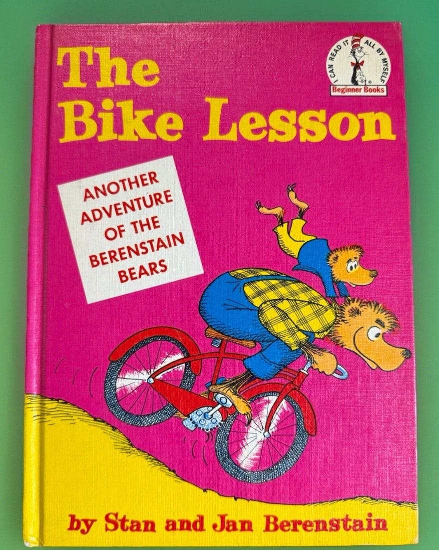 The Bike Lesson Stan & Jan Berenstain 1964 Random Hse Beginner Books HC 1st/1st: The Bike Lesson is a vintage hardcover first edition first printing picture book published by Random House in 1964. Written and illustrated by Stan and Jan Berenstain, this book is part of the Beginne