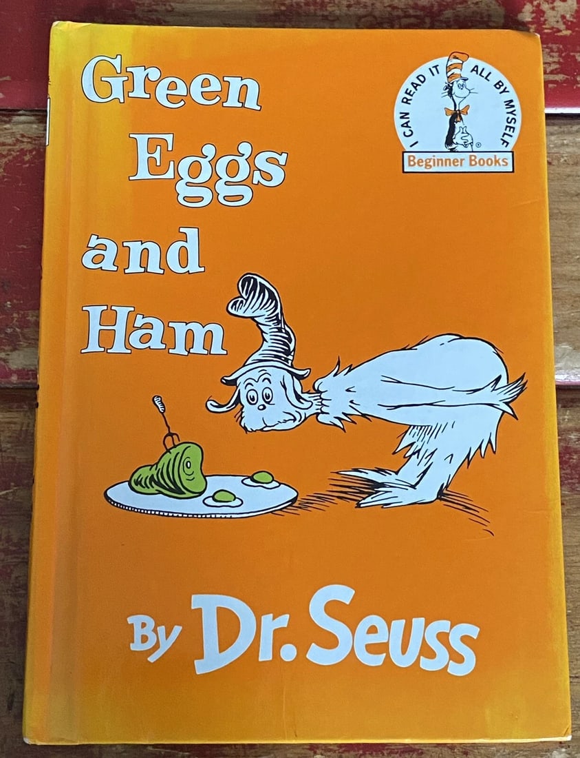 Green Eggs and Ham Dr Seuss Beginner Books Grolier Book Club Edition 1960/1988VG: This hardcover book is a classic children's picture book that will delight both young and old readers. With its imaginative and humorous narrative, Green Eggs and Ham by Dr. Seuss is perfect for those