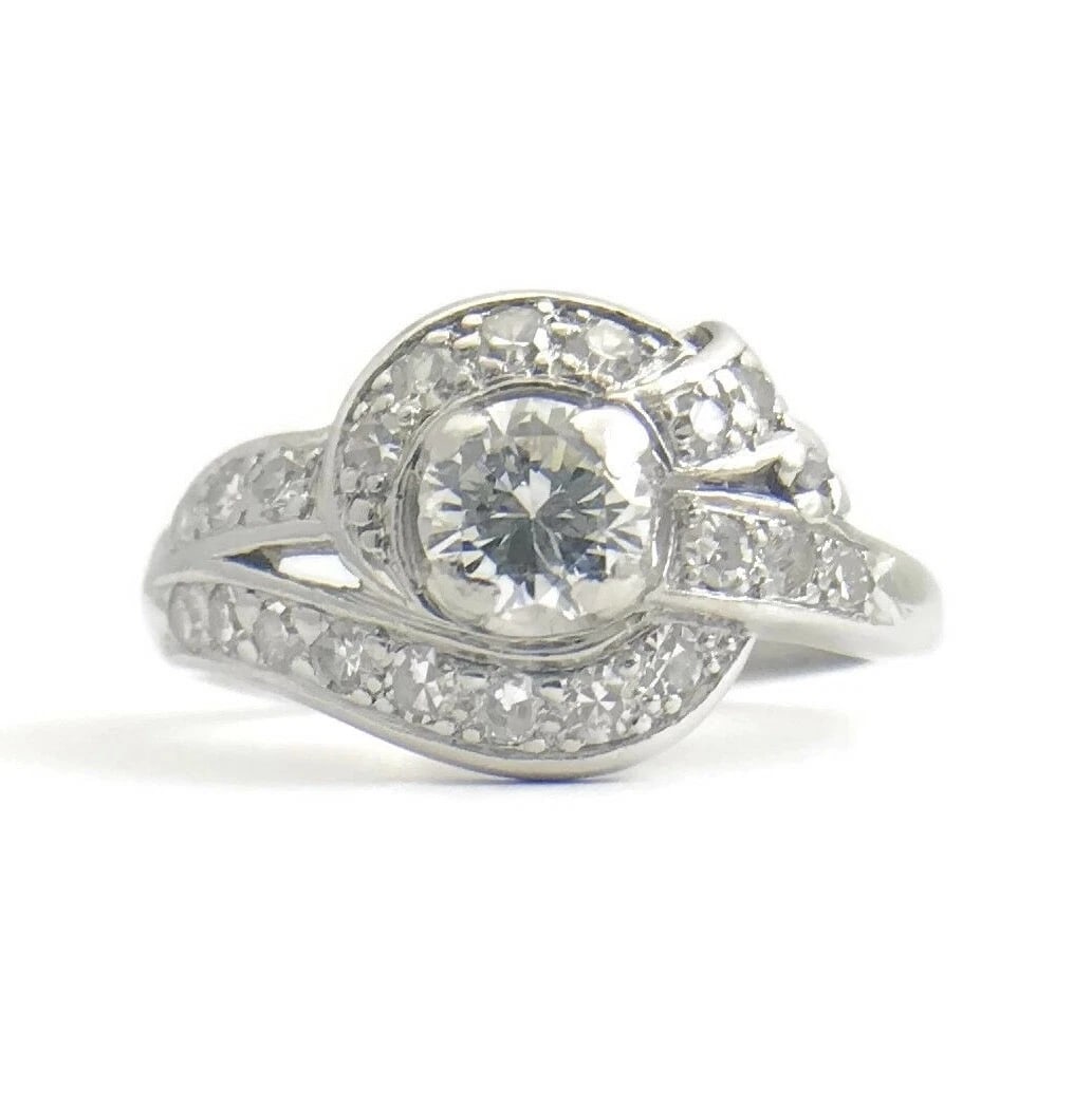 Vintage Art Deco Diamond Platinum Asymmetrical Ribbon Ring .83 ctw, 7.31 Grams: Title: Vintage Art Deco Diamond Platinum Asymmetrical Ribbon Ring .83 ctw, 7.31 Grams Description: Vintage Art Deco Diamond Platinum Asymmetrical Ribbon Ring .83 ctw, 7.31 Grams This is a gorgeous, un