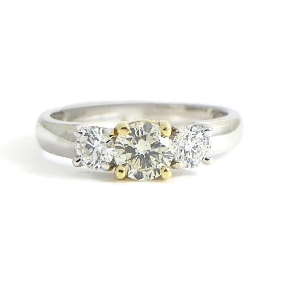 Round 3-Stone Light Yellow Diamond Engagement Ring 18K White Yellow Gold .70 CTW: Title: Round 3-Stone Light Yellow Diamond Engagement Ring 18K White Yellow Gold .70 CTW Description: Round 3-Stone Light Yellow Diamond Engagement Ring 18K White Yellow Gold .70 CTW This is a