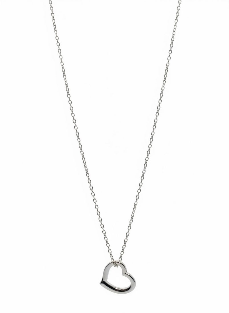 Inspired Silver Open Heart Pendant Necklace: This necklace features a delicate silver-tone chain with an open heart-shaped pendant. The minimalist design is versatile and suitable for everyday wear. The brand "Inspired Silver" is visible on the