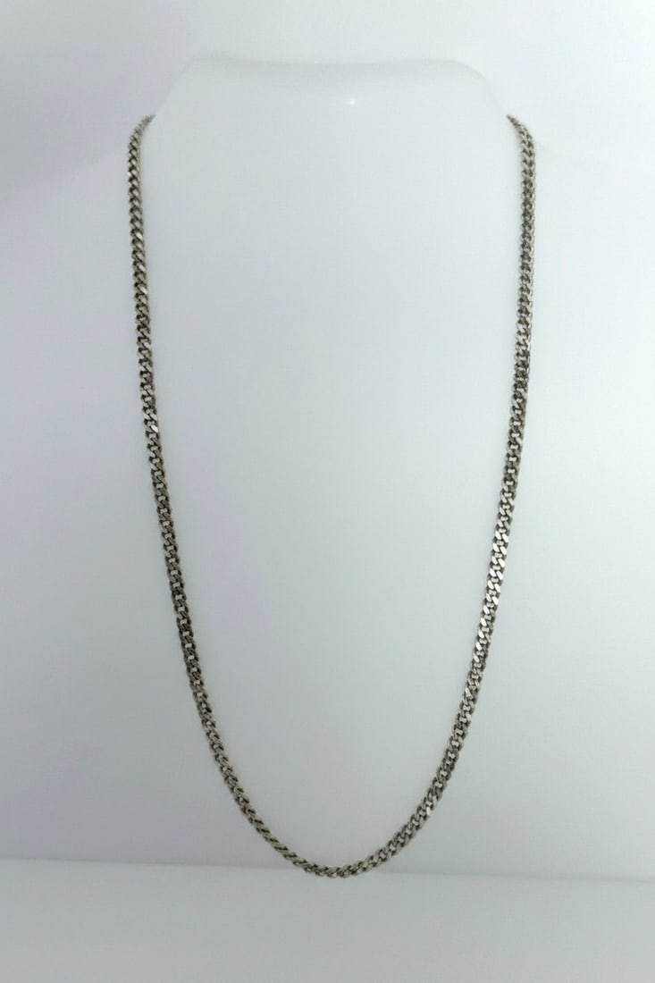 Sterling Silver Curb Link Chain Necklace: A classic sterling silver curb link chain necklace with a lobster clasp closure. The chain has a polished finish and is suitable for everyday wear or layering with other necklaces. Jewelry Type: