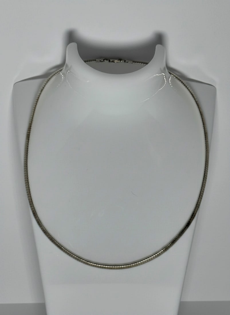 Sterling Silver Italian Omega Chain Necklace: An elegant sterling silver omega chain necklace, crafted in Italy. The necklace features a smooth, flexible design with a lobster claw clasp. Ideal for showcasing pendants or wearing alone as a