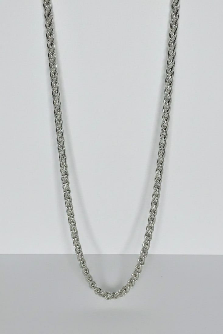Sterling Silver Foxtail Chain Necklace: This contemporary foxtail chain necklace is crafted from sterling silver, featuring a finely woven, flexible design that catches the light. The necklace is secured with a lobster clasp. Jewelry Type: