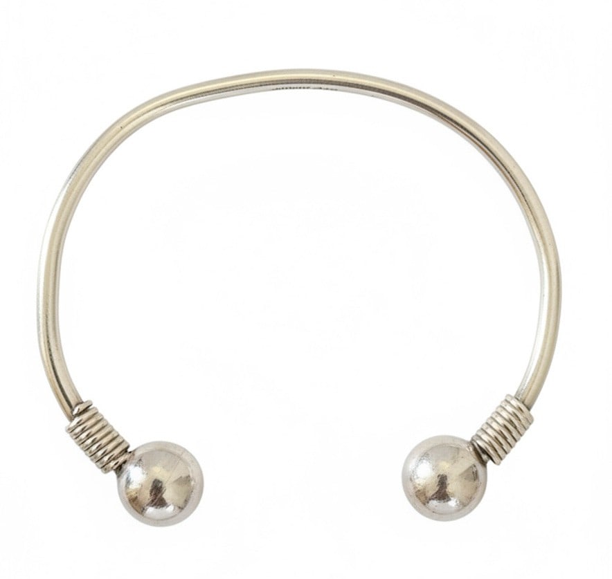 Sterling Silver Ball End Cuff Bracelet: This is a contemporary sterling silver cuff bracelet featuring two polished spherical ball ends. The balls are secured with coiled wire wrapping. The interior is marked with "925 MEXICO". Jewelry