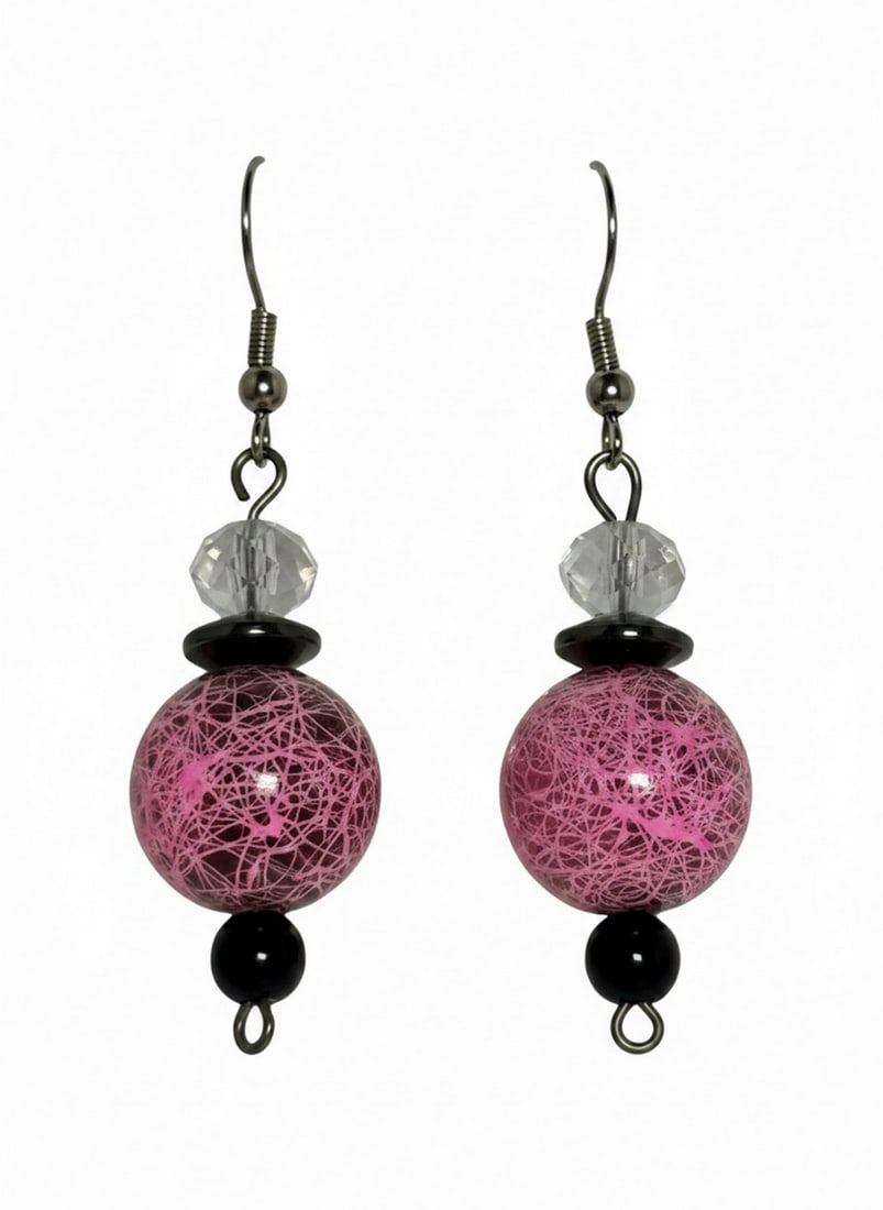 Pink and Black Beaded Dangle Earrings: These earrings feature a combination of pink and black beads. The main bead is a round, pink sphere with a crinkled or marbled white pattern, suggesting painted or lampwork glass. Above this is a