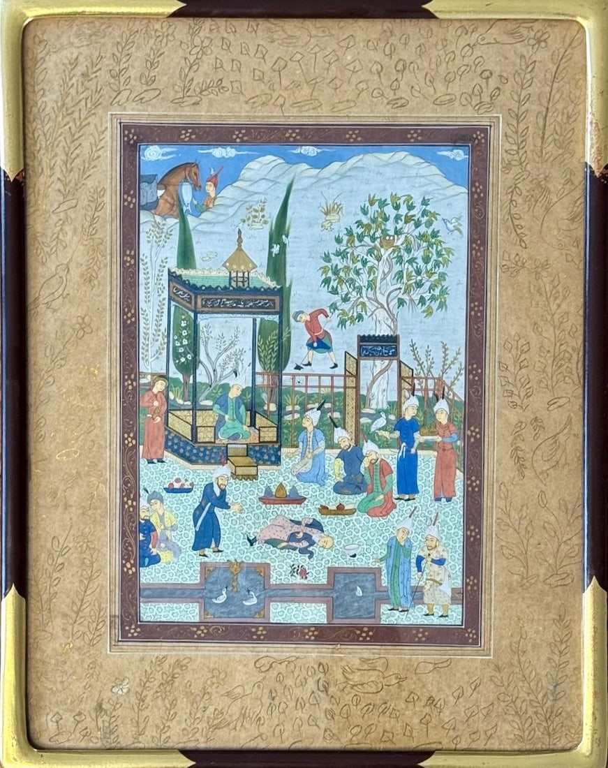 Antique Persian Miniature Painting in Gilt & Ebonized Frame.: A finely detailed and well-preserved antique Persian miniature painting depicting a lively gathering in a garden setting, with figures in traditional attire, architectural elements, and natural
