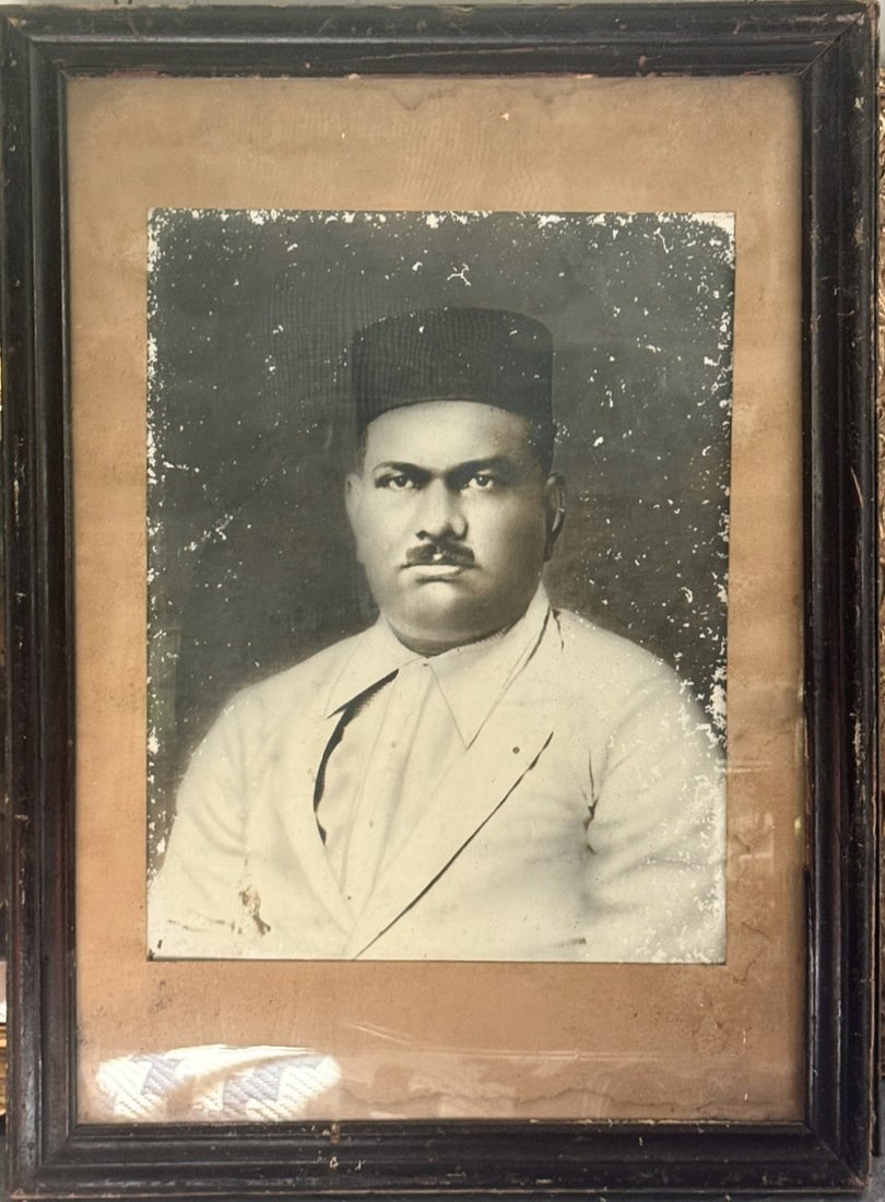Large Portrait of an Indian Gentleman India, Early 20th Century Silver gelatin photograph, Original: A dignified early 20th-century portrait photograph depicting an Parsi - Indian gentleman seated in formal pose, dressed in a traditional cap and tailored jacket. Executed in the restrained studio