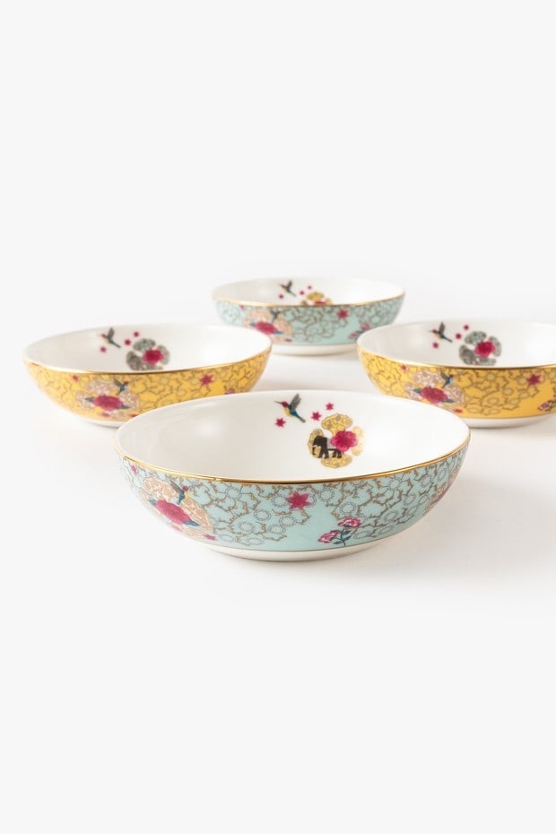 Set of Four Bowls Fine Bone China Accented With 24 Carat Gold by Good Earth: A set of four Serendib dessert bowls by Good Earth, one of India's leading luxury lifestyle brands renowned for reinterpreting traditional Asian decorative arts through contemporary design. Crafted