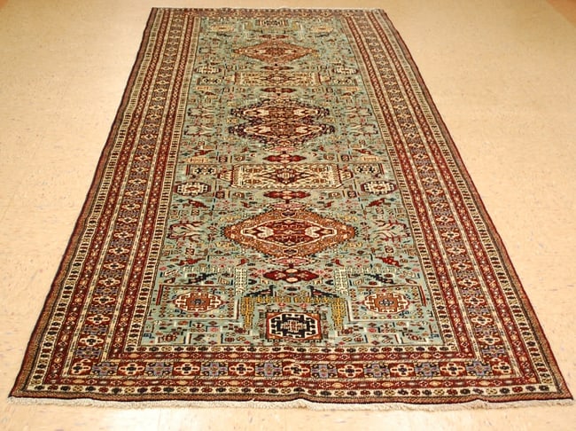 CAUCASIAN SHIRVAN RUG 4.7x11: Title: CAUCASIAN SHIRVAN RUG 4.7x11 Description:ANTIQUE HIGHLY DETAILED MINT CAUCASIAN SHIRVAN DESIGN RUGwith an exact size of 4' 7" x 11' .Rare Green field with many detailed Animal