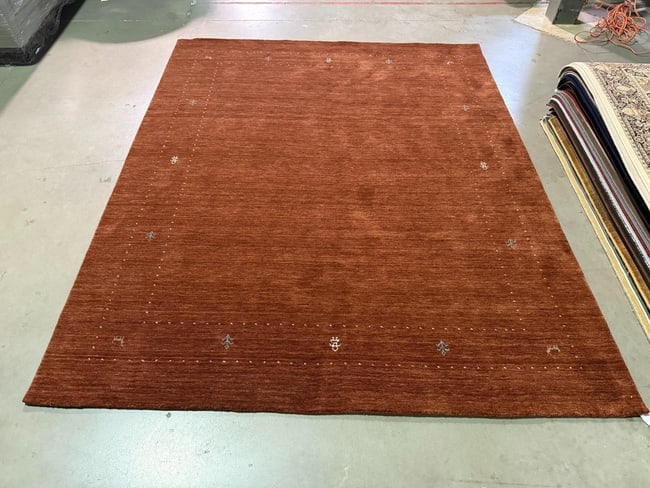 Magnificent Gabbeh Rug 8x10: Title:Magnificent Gabbeh Rug 8x10 Description:Decorative Fine weave Gabbeh rug, 100% natural Veggie Dye wool pile in Rust color. Hand Knotted in India,8'x10' Reserve: $1,100.00 Shipping: Domestic: Fla