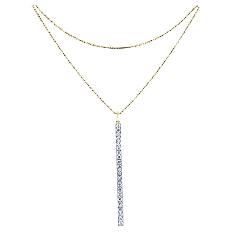 Platinum Diamond Bar Pendant 18k Gold Chain Necklace: Materials: 18k Gold Chain, Platinum Pendant Weight: Chain - 12 Grams; Pendant - 4.7 Grams Gemstone: Diamond Measurement: Pendant - 3" Chain - 30" ITEM DETAILS: A long diamond bar pendant necklace
