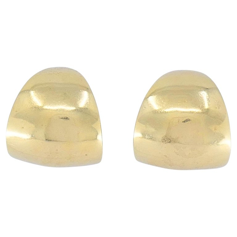 Vintage 14k Gold Sculptural Hoop Earrings: Vintage 14k gold half-hoop earrings with a crescent profile. The thick, domed front curves around the earlobe, with a smooth polished exterior and a lightly textured interior that catches the light. S