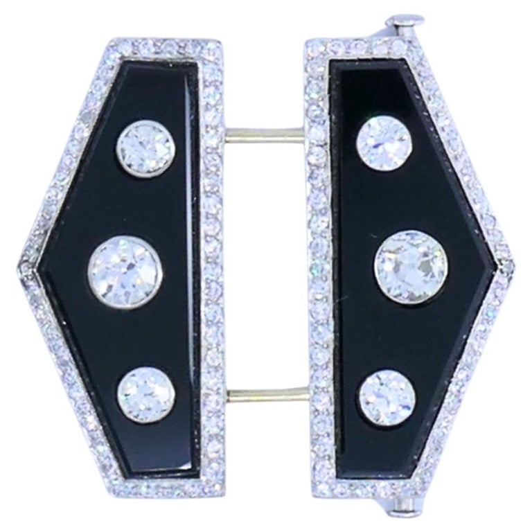 Art Deco Platinum Diamond & Onyx Double Clip Brooch Charlton & Co.: A Charlton & Co. Art Deco double clip brooch made of platinum, with two polished black onyx panels accented with diamonds. The pin closure is made of 18k white gold. The brooch is set with Old Europea